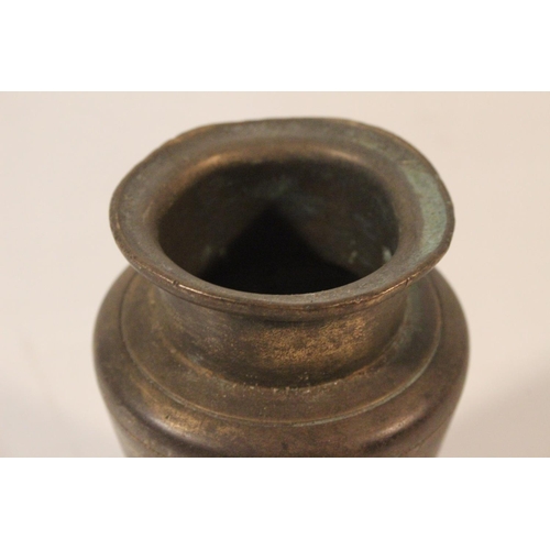 99 - A small antique heavy brass vase.