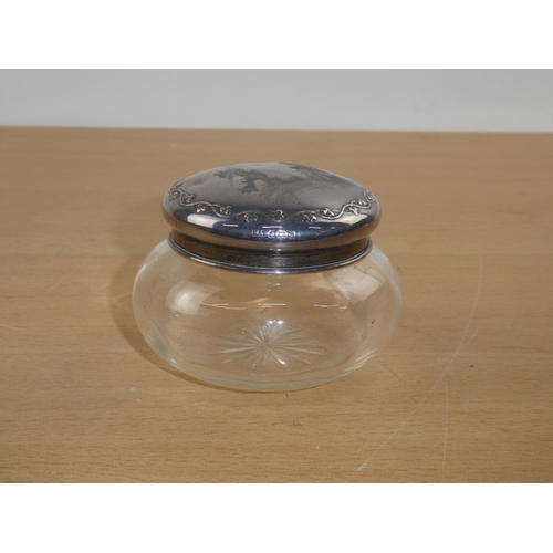 102 - A Sterling Silver topped dressing table jar.