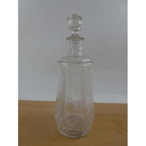 104 - A vintage pressed glass decanter.