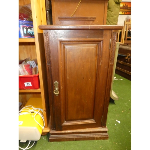 123 - An antique mahogany bedside cabinet with carved side panels.