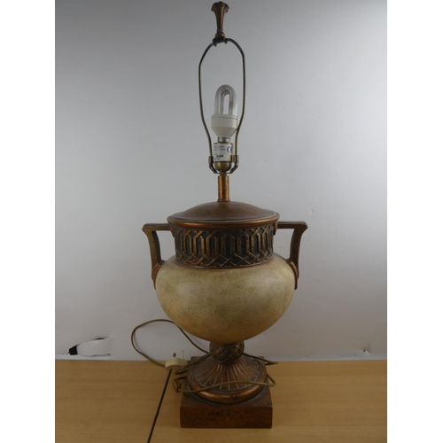 129 - A large ceramic table lamp base with gilt detail.