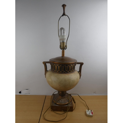 129 - A large ceramic table lamp base with gilt detail.