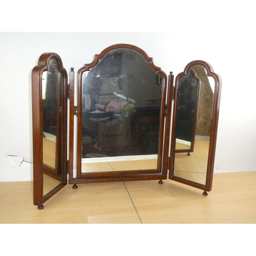 130 - An antique mahogany dressing table mirror.