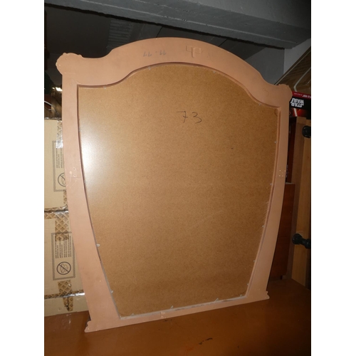 135 - A large ornate framed mirror.