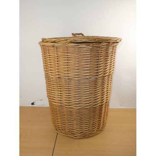 142 - A large wicker lidded linen basket.