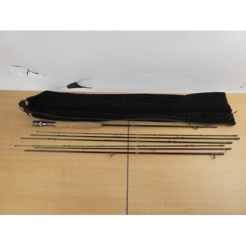 153 - A Scierra sweep three piece 9ft fishing rod and bag.