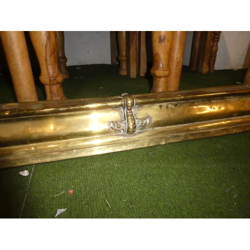 163 - An antique brass fender.