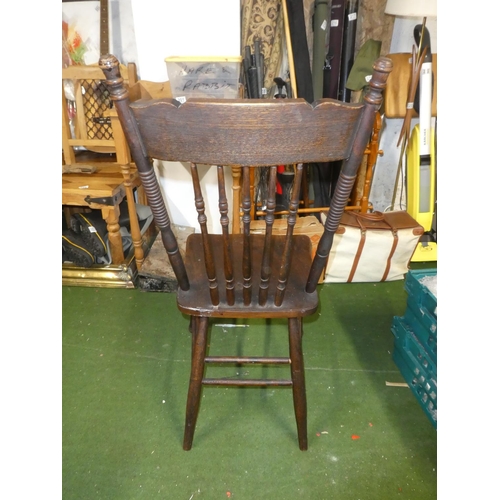 168 - An Oak carved chair .