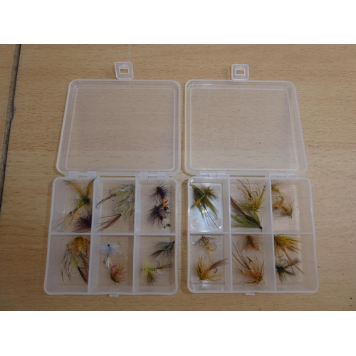 176 - Two small plastic storage boxes containing fishing flies.