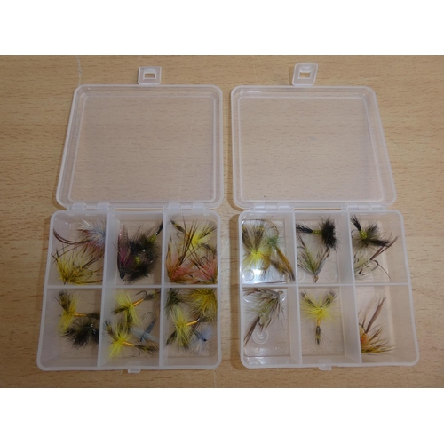 191 - Two small plastic storage boxes containing fishing flies.