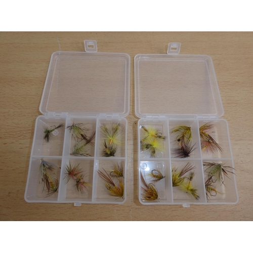 200 - Two small plastic storage boxes containing fishing flies.