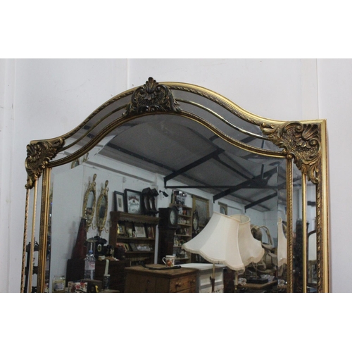 18 - A stunning large modern mirror with decorative gilt detail, measuring 97x180cm.