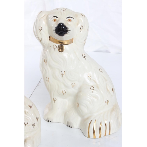 71 - A collection of antique Staffordshie Spaniels/ dogs, to include a pair by Beswick & more.