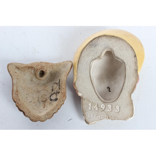 76 - A pair of small ceramic wall masks (a/f), largest 10cm.