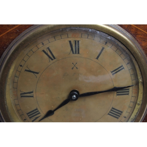 88 - An antique mantle clock with inlaid wooden case.