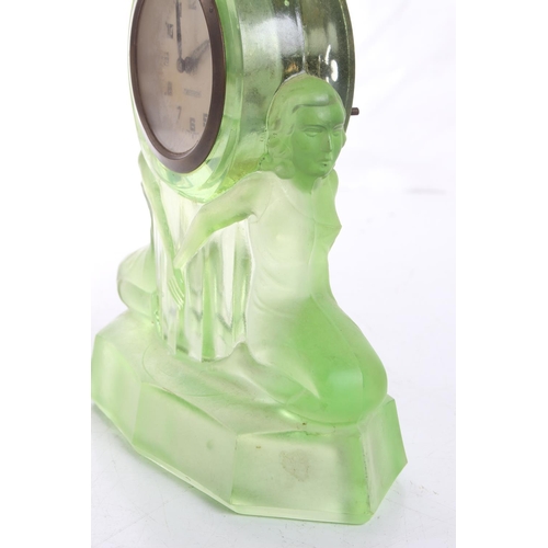 112 - A stunning antique/ Art Deco Mercedes mantle clock in decorative Uranium Glass case, measuring 7