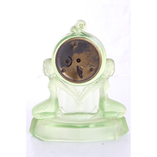 112 - A stunning antique/ Art Deco Mercedes mantle clock in decorative Uranium Glass case, measuring 7