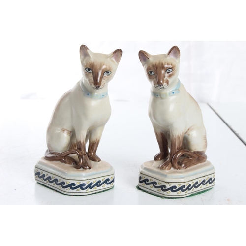 113 - A pair of small antique style ceramic cats.