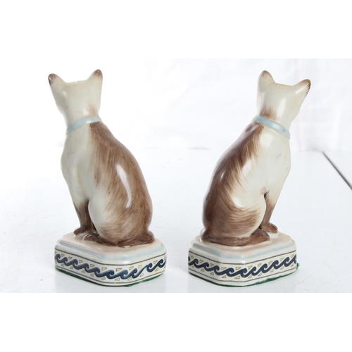 113 - A pair of small antique style ceramic cats.