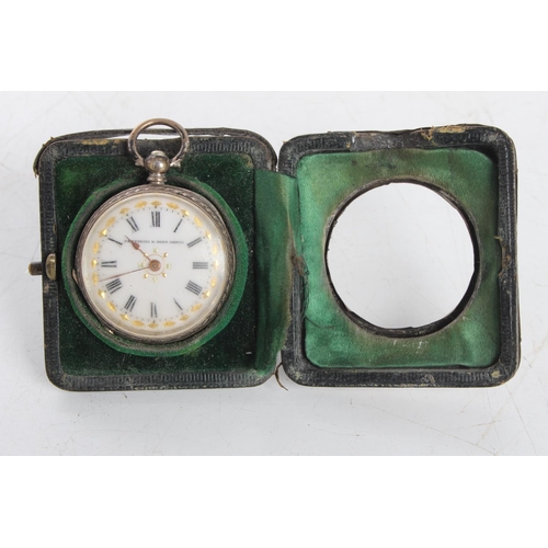 114 - A stunning antique sterling silver cased ladies pocket watch in sterling fronted stand/ case.