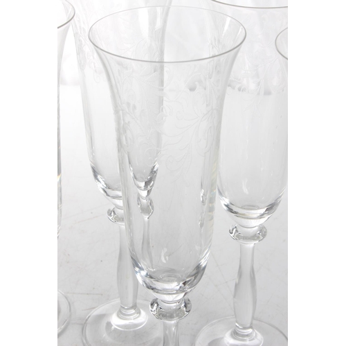 116 - A set of 6 decorative champagne flutes.