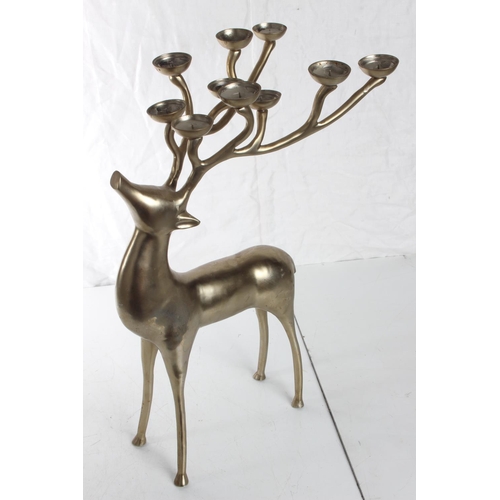 140 - A large metal reindeer candleholder, measuring