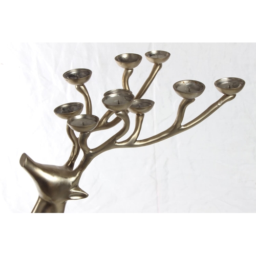 140 - A large metal reindeer candleholder, measuring