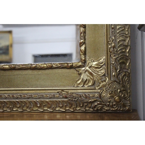 141 - A stunning large mirror with decorative gilt frame, measuring approx 40x49.5inches