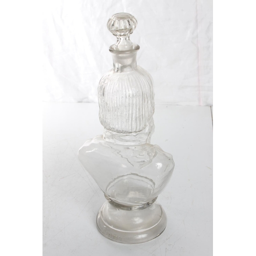 144 - An unusual glass 'bust' decanter. Measuring 12.5inches.