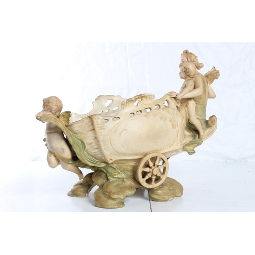 148 - A stunning large Royal Dux flower basket, modelled as an Angel with 2 Cherubs & cart, stamped 4741 t... 