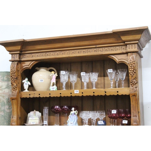 154 - A large modern pine dresser with decorative carved detail, measuring 53x20x48inches.