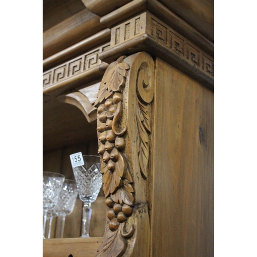 154 - A large modern pine dresser with decorative carved detail, measuring 53x20x48inches.