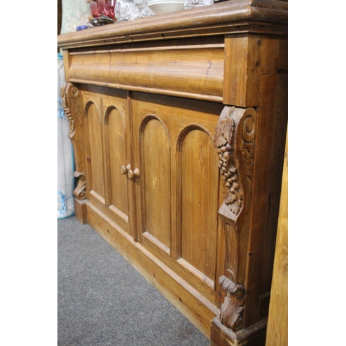 154 - A large modern pine dresser with decorative carved detail, measuring 53x20x48inches.