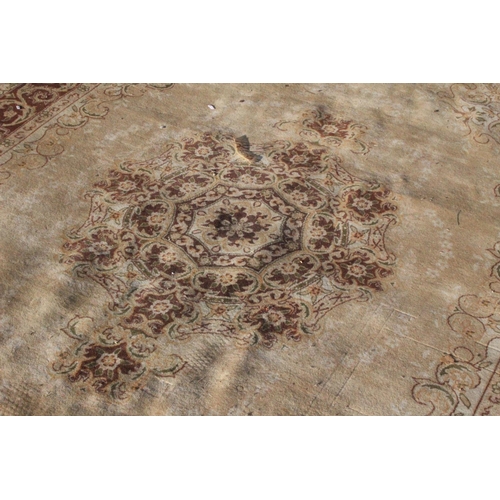 212 - A large patterned floor rug, measuring 180cm x 270cm.