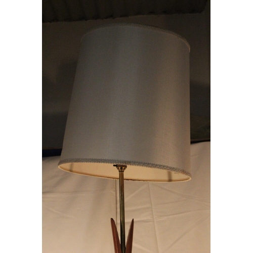 220 - A vintage standard lamp and shade.