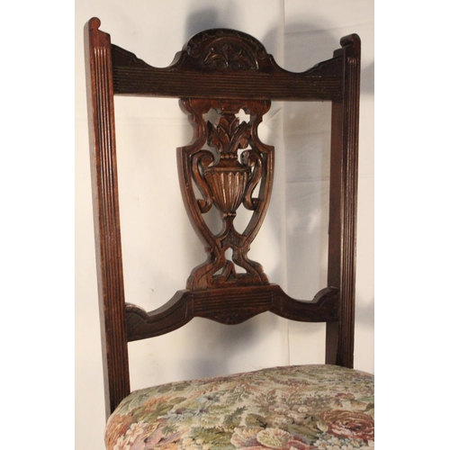 237 - A vintage mahogany nursing/occasional chair.