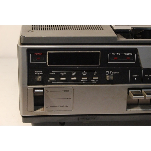 257 - A vintage Sanyo 3 Cord video cassette recorder.