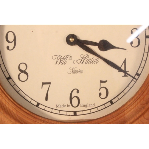 272 - A pine framed William Stinton wall clock.