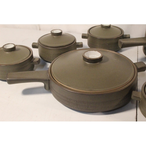 408 - Two vintage Denby casserole dishes and five lidded bowls.