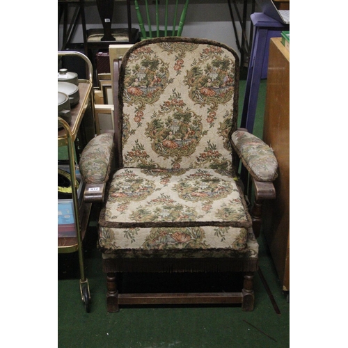 412 - A vintage upholstered armchair.