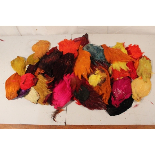 416 - A large lot of assorted dyed fly tying feathers.