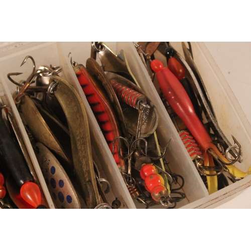 553 - A box of assorted fishing lures.