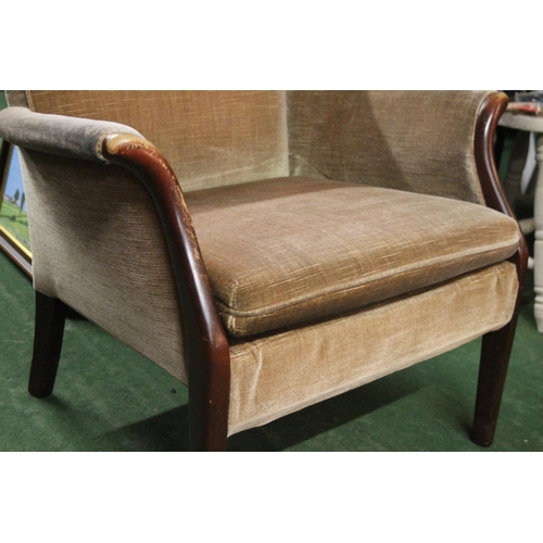 565 - A Parker Knoll armchair.