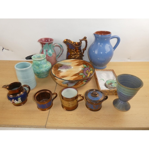 323 - A large lot of assorted pottery including Beswick, studio pottery and lots more.