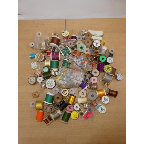 340 - A mixed lot of fishing beads, scissors and fly tying materials.