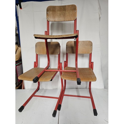 4 - A set of 3 vintage/ retro stacking school chairs with red metal frames.