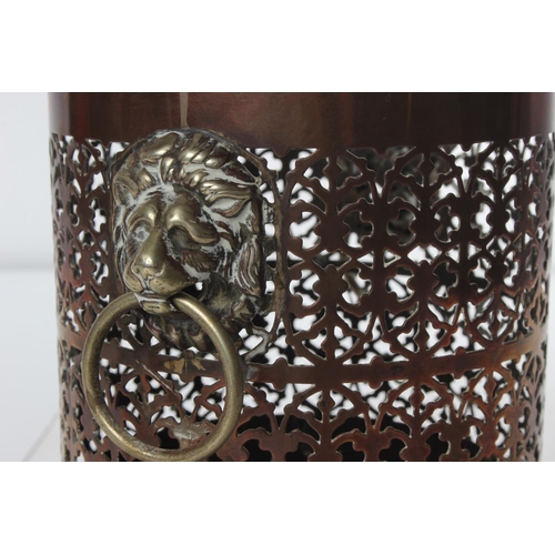 183 - An antique copper & brass wine bottle holder, with lion mask handles.