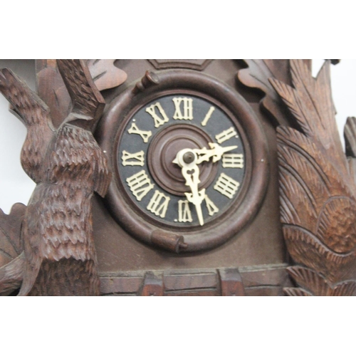 191 - A vintage Cuckoo clock, with carved panels, in need of some light restoration.