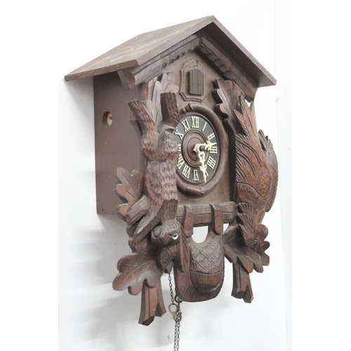 191 - A vintage Cuckoo clock, with carved panels, in need of some light restoration.