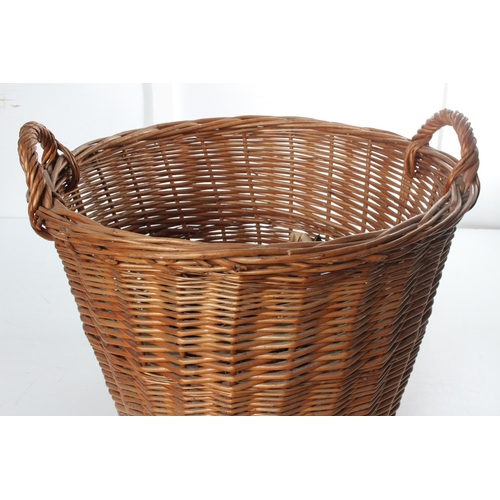 193 - A large wicker log basket.